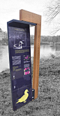 Outdoor freestanding information pylon sign at Lac de Louvain-la-Neuve by Traces TPI