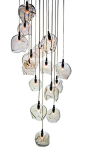 "Infinity Cluster" pendant light fixture by John Pomp Studios has 15 hand-blown sculpted glass canopies at different heights. (Beautiful over a staircase or in a foyer, provided the ceiling height accommodates it.)