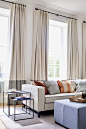 Curtains almost full height of room. wide band at base adds 2nd color and organizing definition of an elevation