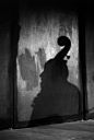 semioticapocalypse:

Guy Le Querrec. Tchad, N’Djamena. At the French cultural center. Shadow of the French jazz musician Henri Texier (double bass) during the concert of his trio.

