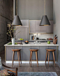 Not so obvious gold accents, different shades of grey, light marble counter top, white trim, wood pieces.: 