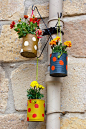 Hanging flowerpots made with cans. by asife on @creativemarket