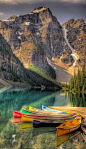 Colorful canoes on Moraine Lake at Banff National Park in the Canadian Rockies of Alberta, Canada: 