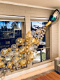 Champagne bottle balloon wall for bachelorette party. This is perfect for any party but especially glam for a New Years Eve party. The confetti balloons really made this perfect. New Year’s Eve balloons, champagne balloon wall #diypartydecorationsballoons