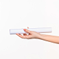 cylinder-female-hands-white-wall_155003-11863