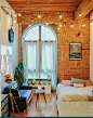 home decor | studio apartment | interior design | apartment decoration | bohemian | fairy lights | exposed brick wall | big arched window