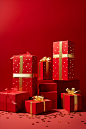 Christmas presents on red background with gold ribbon, in the style of danish design, do ho suh, light-filled compositions, confetti-like dots, minimalist photography, colorized, de stijl