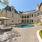 BOXWOOD : This formal residence is located in Highland Park, Texas features intensely manicured gardens, a cobblestone driveway, private motor court and a grand entry gate. 