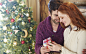 Couple exchanging gifts on Christmas by Caia Images on 500px