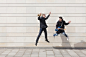 Trumpet player and guitarist jumping in urban environment Free Photo