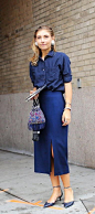 Jenny Walton in a blue button down and slit skirt: 