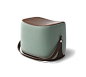 Ottoman Hermes ottoman with strap that makes it highly portable. L21.1" x H14.1" x W13.6". Storage area covered in chocolate leather.<br />Cover in sage green Palomino velvet.<br /><br />Recalling the shape of a saddle, th