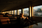 a woman sitting on a train looking out the window