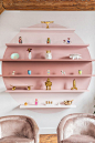 a soft pink bookshelf