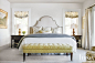 Transitional White Master Bedroom : Inspired by nature, the designer incorporated citrine and chartreuse into the master bedroom— seen in Schumacher’s bold geometric fabric on the Lee Industries bench, and the feminine botanical prints on the pillows. Cir