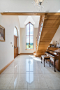 Inspiration for a large traditional hallway in Other with a single front door, a medium wood front door, porcelain flooring, beige walls and white floors.