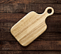Cutting board on dark wooden table, top view by Max Lashcheuski on 500px
