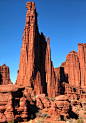 This may contain: red rock formations in the desert under a blue sky