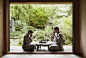 Photograph Caucasian couple in robes drinking tea in zen garden by Gable Denims on 500px