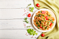 Fusilli pasta with tomato sauce, cherry tomatoes, lettuce and herbs Premium Photo