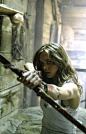 Lyra held the bow with the nocked arrow at the door, as it jiggled open, and revealed a young man.  He held his hands up in defense seeing the girl ready to shoot. "Ten seconds. Who are you?" she snapped. He began fumbling for words. Lyra rolled