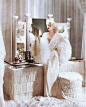 Jean Harlow, born Harlean Harlow Carpenter; (1911-1937) American film actress & sex symbol of the 1930.  Here she is sitting at her 1930s fringed Art Deco dressing table: 