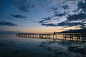 Photo of Person Walking on Dock