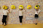 Passers-by pose for photos with emoji hats fixed on a wall in a shopping mall in Guangzhou on May 18, 2016 in Guangdong, China. Feature China / Barcroft Images hello@barcroftmedia.com - +1 212 796 2458 +91 11 4053 2429