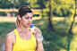 Young woman taking a break and drink some water by Igor Milic on 500px