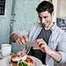 Man using a food app at a restaurant