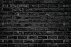 抽象深色砖墙纹理背景图案，墙砖表面纹理。砖漆黑色内部旧干净混凝土网格不平，家庭或办公室设计背景装饰。