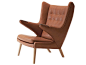 Upholstered leather armchair with 