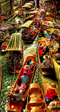 Damnoen Saduak Floating Market in Thailand • "Arguably the most famous floating market in Thailand, it is located off Highway 325 about 110 kilometers southwest of Bangkok." • blogger: M.G. Edwards / http://worldadventurers.wordpress.com/2012/01