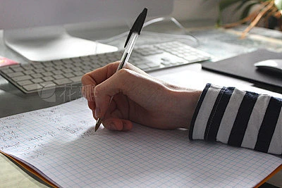 Image of college school boy doing maths homework with biro pen, teenage ...