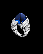 Alexandre Reza “Turban” Sapphire Ring featuring unheated sugar-loaf Ceylon sapphire weighing 27.74cts surrounding baguette diamonds set upside down weighing 6.68cts.