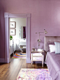 Inspiration for a contemporary brown floor bedroom remodel in New York with purple walls