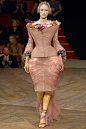 Image may contain Clothing Apparel Human Person Fashion Runway Robe Gown Evening Dress Female Costume and Dress