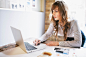 Businesswoman working at laptop in meeting room. by EasyPx on 500px