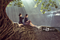 Two asian girl living at the waterfall After the completion of farming._创意图片