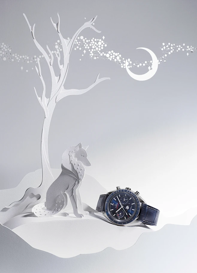 Omega Winter Wonders : A paper winter wonderland created for Omega Watches' latest holiday editorial, featuring a layered paper bear, an enchanted castle and a peacock with a tail created from miniature watch cogs.Photographer | Luke KirwanSet Design &amp