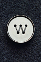 W.