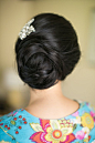 Sophisticated updo and accessorized with a sparkly comb.