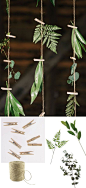 DIY greenery hanging backdrop with twine, clothespins, and faux greenery from afloral.com #diywedding: 