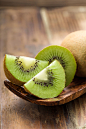 Kiwi, whole and cut by Christian Fischer on 500px