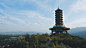 brown temple near mountains during daytime