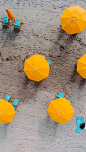 five yellow umbrellas on sand at daytime