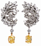 8.53ct Fancy Intense Diamond Platinum & Gold Drop Earrings. These earrings are crafted in solid platinum & 18K yellow gold. These earrings features a drop of two 1.72ct natural fancy intense yellow diamond, VVS2 clarity, and 1.81ct natural fancy y