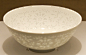 景德镇用影青釉制作的“玲珑瓷”。
　　
　　所谓“玲珑”，又叫“玲珑眼”、“芝麻漏”，先在较薄的胎体上透雕出花纹，通体上釉，花纹处填满透明釉，而烧制成一种对光透影、玲珑剔透的效果。
　　玲珑瓷器的产生源于产品缺陷。在宋代景德镇瓷器中有一种叫熏炉的产品，炉盖采用镂空装饰，在烧成过程中，由于釉料的高温流动性好，加之烧成温度往往控制不严，常使窑内温度过高，从而使釉料熔融后流动而将炉盖上的孔洞填平，出窑后对光一照，光亮透明。
　　这种偶然的产品缺陷却使工匠们大受启发，终于在明代永乐年间成功烧制出晶莹剔透的