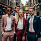 photo of a group of 5 young professionals that are dressed in OGER clothing in a Tenue de Ville style. They are more focussed on their looks and looking pretty than working.