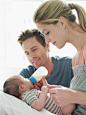 High-Res Stock Photography: Parents Feeding Baby